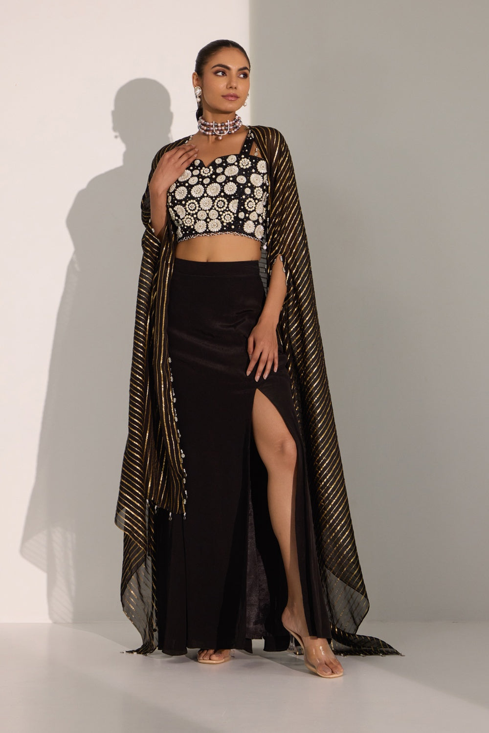 Black Bustier With Side Slit Skirt & Cape Set.