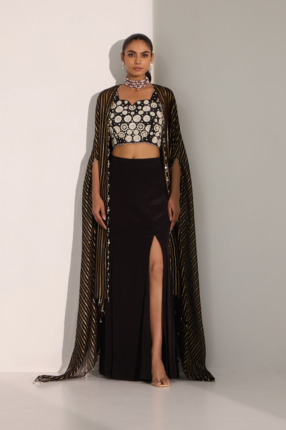Black Bustier With Side Slit Skirt & Cape Set.
